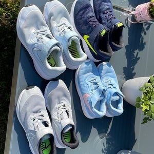 Four pair of Nike sneakers